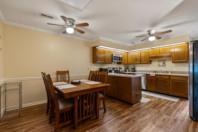 6755 Hickory Creek Rd, Chattanooga, TN 37421 - kitchen featuring stainless steel appliances, a ceiling fan, dark wood-style floors, a textured ceiling, and light countertops