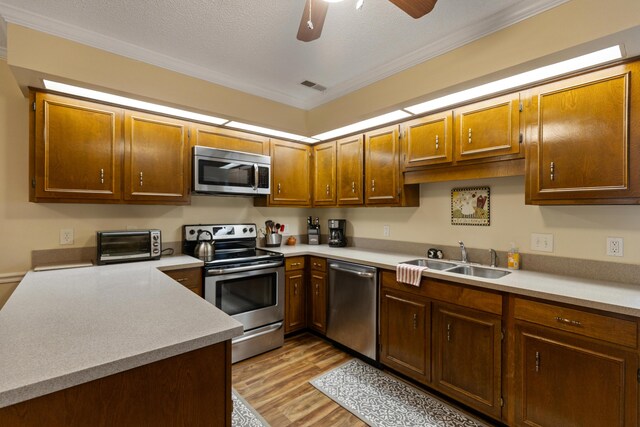 6755 Hickory Creek Rd, Chattanooga, TN 37421 - kitchen with stainless steel appliances, a sink, light countertops, light wood-type flooring, and ceiling fan