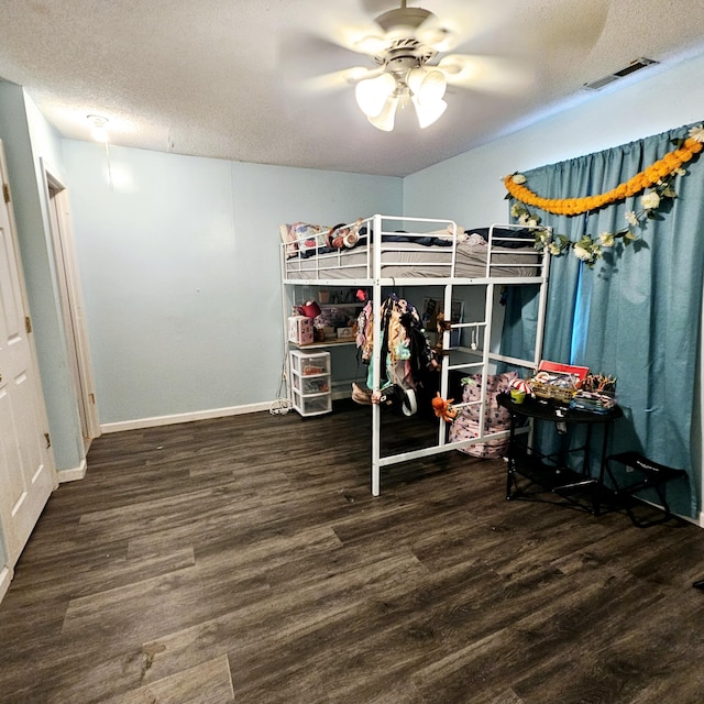 1610 Castleberry Ave, Chattanooga, TN 37412 - bedroom with wood finished floors, baseboards, a textured ceiling, and ceiling fan