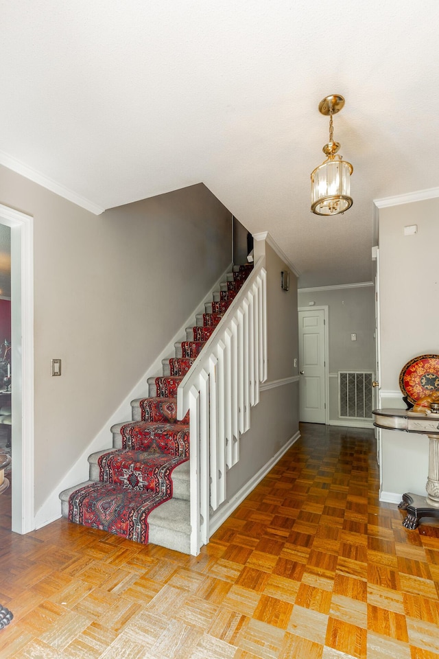 1820 Colonial Way Cir, Hixson, TN 37343 - stairs with ornamental molding, a chandelier, and baseboards