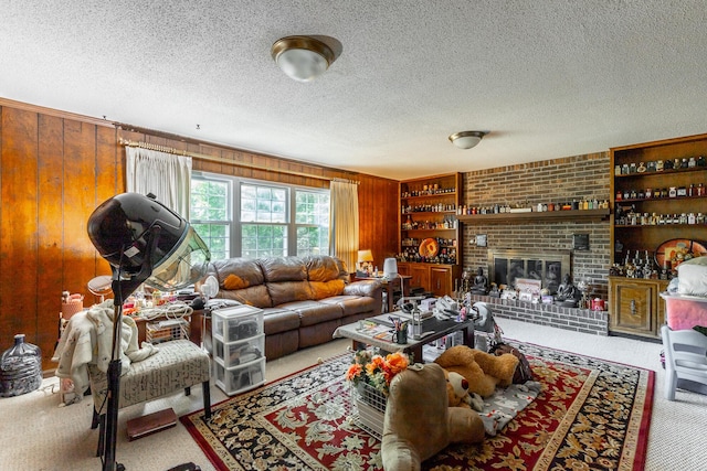 1820 Colonial Way Cir, Hixson, TN 37343 - living area featuring a textured ceiling, wooden walls, carpet, and a fireplace