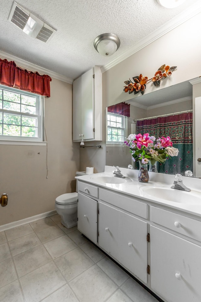 1820 Colonial Way Cir, Hixson, TN 37343 - full bathroom featuring crown molding, double vanity, toilet, a textured ceiling, and tile patterned floors