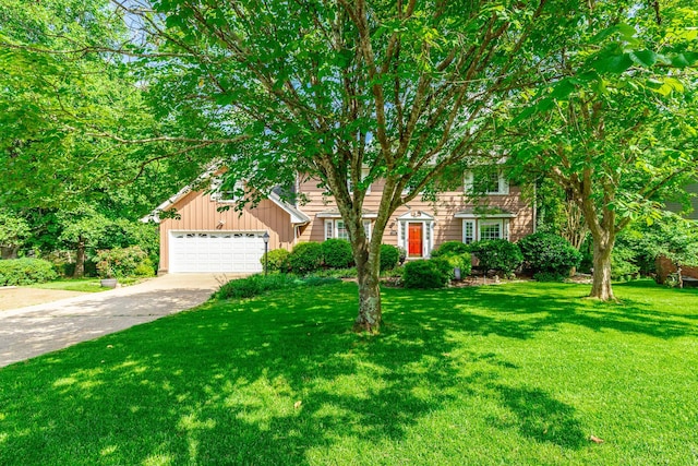 1820 Colonial Way Cir, Hixson, TN 37343 - view of front facade featuring a front yard, driveway, an attached garage, and board and batten siding