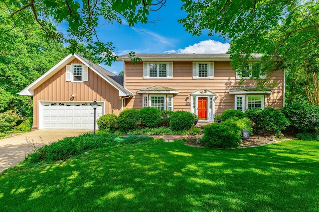 1820 Colonial Way Cir, Hixson, TN 37343 - colonial home with a front lawn, driveway, board and batten siding, and a garage