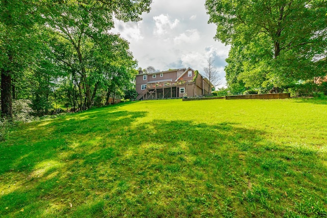 1820 Colonial Way Cir, Hixson, TN 37343 - view of green lawn with stairs and a wooden deck
