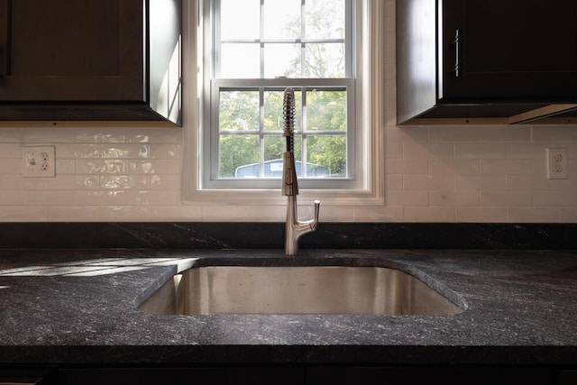 4407 Bennett Rd, Chattanooga, TN 37412 - detailed view of decorative backsplash, dark stone counters, and dark brown cabinetry