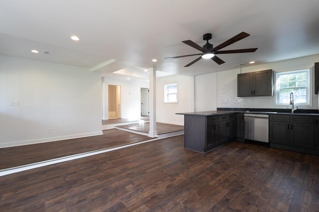 4407 Bennett Rd, Chattanooga, TN 37412 - kitchen featuring dishwasher, a peninsula, dark countertops, open floor plan, and dark wood finished floors