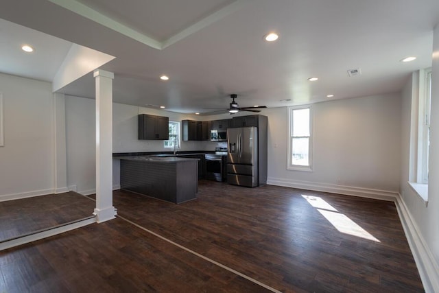 4407 Bennett Rd, Chattanooga, TN 37412 - kitchen featuring stainless steel appliances, dark countertops, a ceiling fan, open floor plan, and dark wood finished floors