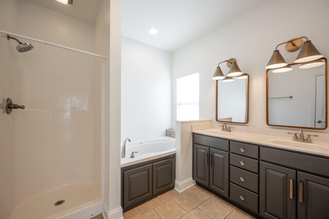8539 Lexie Ln, Ooltewah, TN 37363 - bathroom featuring tile patterned flooring, double vanity, a garden tub, and a shower