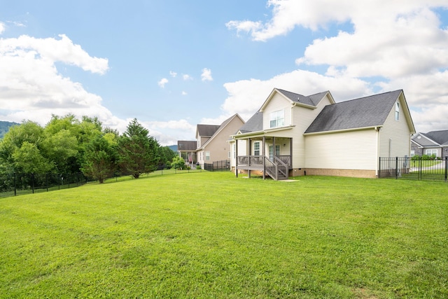 8539 Lexie Ln, Ooltewah, TN 37363 - rear view of property featuring a fenced backyard and roof with shingles