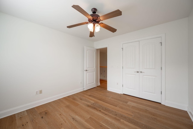 8539 Lexie Ln, Ooltewah, TN 37363 - unfurnished bedroom featuring light wood finished floors, a closet, and ceiling fan