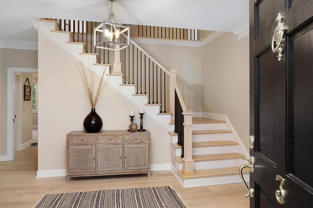 3 Chamblee Ct, Signal Mountain, TN 37377 - foyer entrance featuring stairs, light wood-style flooring, ornamental molding, and a chandelier