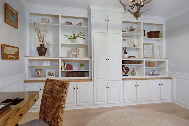 3 Chamblee Ct, Signal Mountain, TN 37377 - detailed view of ornamental molding, built in features, wood finished floors, a chandelier, and a decorative wall