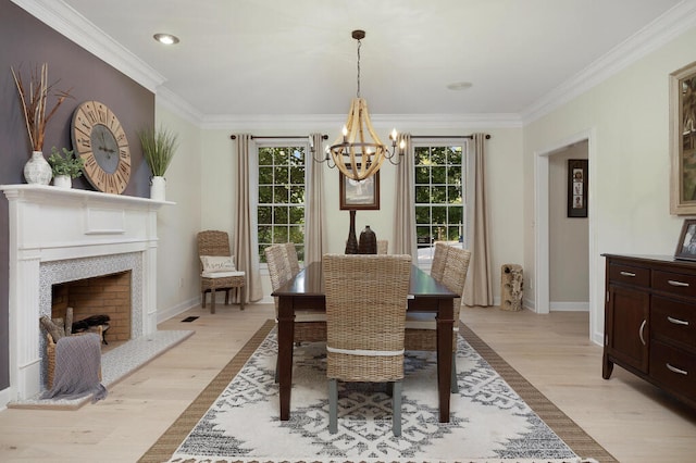 3 Chamblee Ct, Signal Mountain, TN 37377 - dining area featuring a chandelier, light wood-type flooring, crown molding, a fireplace, and recessed lighting