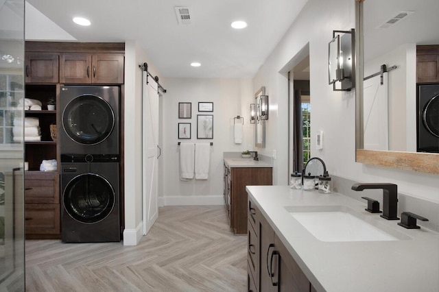 3 Chamblee Ct, Signal Mountain, TN 37377 - bathroom with stacked washing machine and dryer, two vanities, and recessed lighting
