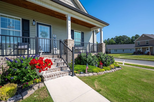 421 Coahulla Creek Dr, Dalton, GA 30721 - doorway to property featuring a porch and a yard