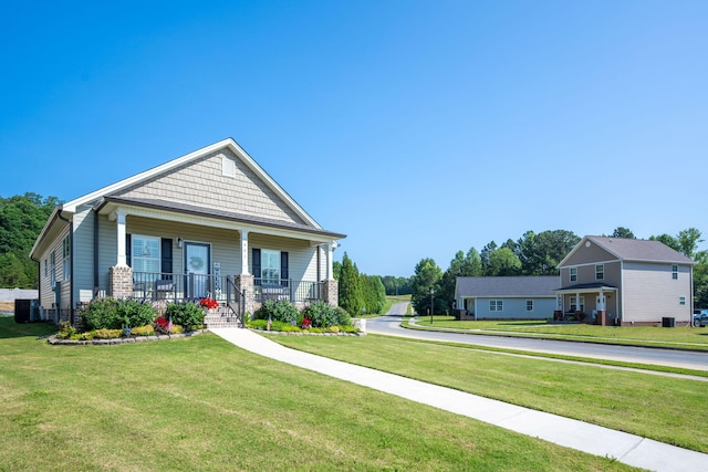 421 Coahulla Creek Dr, Dalton, GA 30721 - craftsman-style home featuring a porch, a front yard, and cooling unit