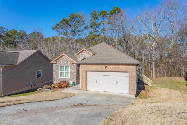 2367 Lake Mist Dr, Chattanooga, TN 37421 - traditional-style home with driveway, a garage, roof with shingles, a front yard, and brick siding