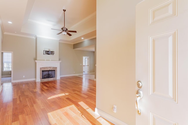2367 Lake Mist Dr, Chattanooga, TN 37421 - unfurnished living room featuring plenty of natural light, light wood finished floors, ceiling fan, a fireplace, and ornamental molding