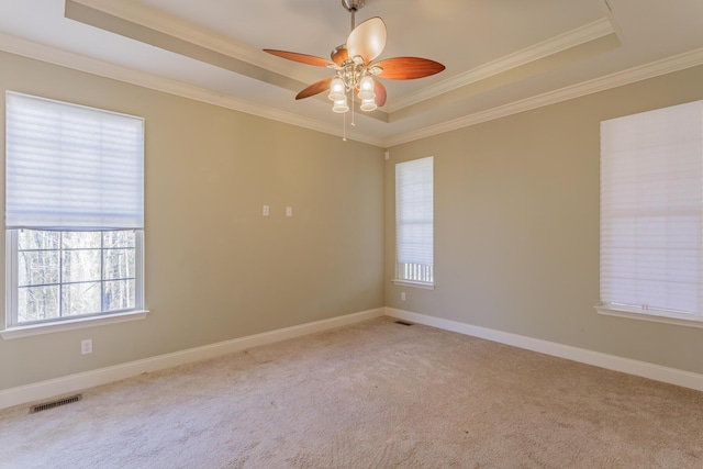 2367 Lake Mist Dr, Chattanooga, TN 37421 - spare room with a raised ceiling, plenty of natural light, ornamental molding, carpet floors, and ceiling fan