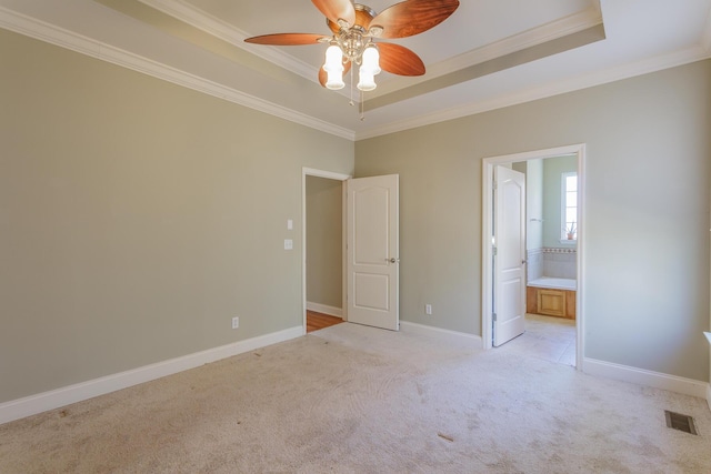 2367 Lake Mist Dr, Chattanooga, TN 37421 - unfurnished bedroom featuring ornamental molding, light colored carpet, a tray ceiling, connected bathroom, and a ceiling fan