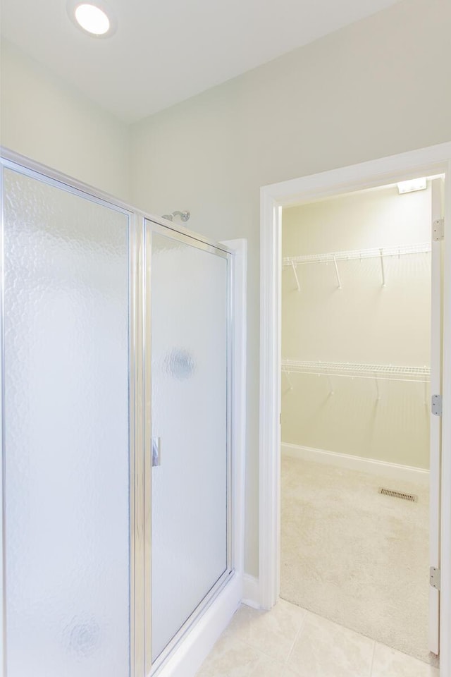 2367 Lake Mist Dr, Chattanooga, TN 37421 - full bath featuring a shower stall, tile patterned floors, and a walk in closet