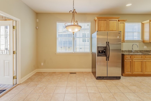 2367 Lake Mist Dr, Chattanooga, TN 37421 - kitchen featuring stainless steel refrigerator with ice dispenser, dark stone counters, light tile patterned floors, and pendant lighting
