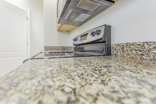 2367 Lake Mist Dr, Chattanooga, TN 37421 - kitchen with electric range oven, light stone countertops, and extractor fan