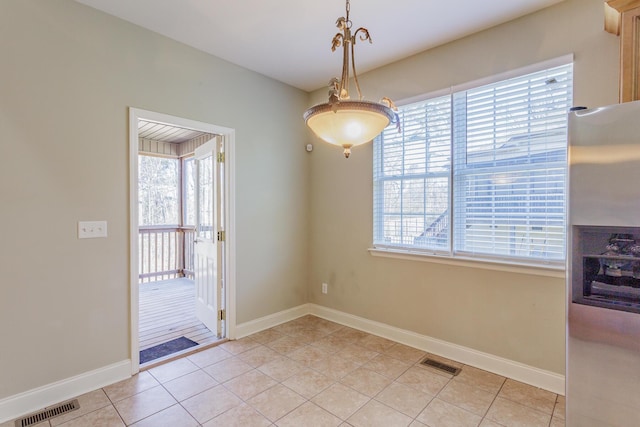 2367 Lake Mist Dr, Chattanooga, TN 37421 - unfurnished dining area with healthy amount of natural light and light tile patterned flooring