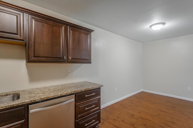 900 Mountain Creek Rd Unit Q263, Chattanooga, TN 37405 - kitchen with dishwasher, dark brown cabinets, dark wood-style flooring, built in desk, and light countertops
