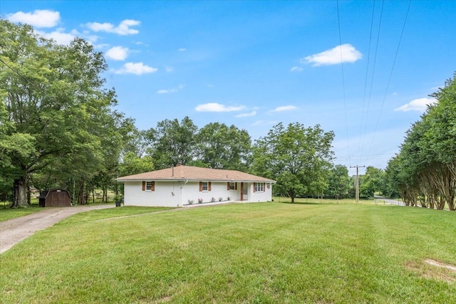 918 Old Lafayette Rd, Chickamauga, GA 30707 - view of front of property with a front yard, a shed, driveway, and view of wooded area