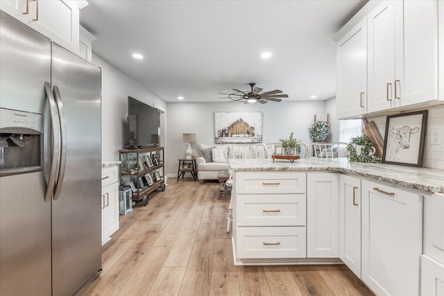 918 Old Lafayette Rd, Chickamauga, GA 30707 - kitchen with stainless steel refrigerator with ice dispenser, a peninsula, a ceiling fan, white cabinetry, and recessed lighting