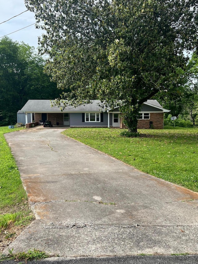 4510 Bluffwood Way, Cohutta, GA 30710 - ranch-style home with concrete driveway, a front yard, and brick siding