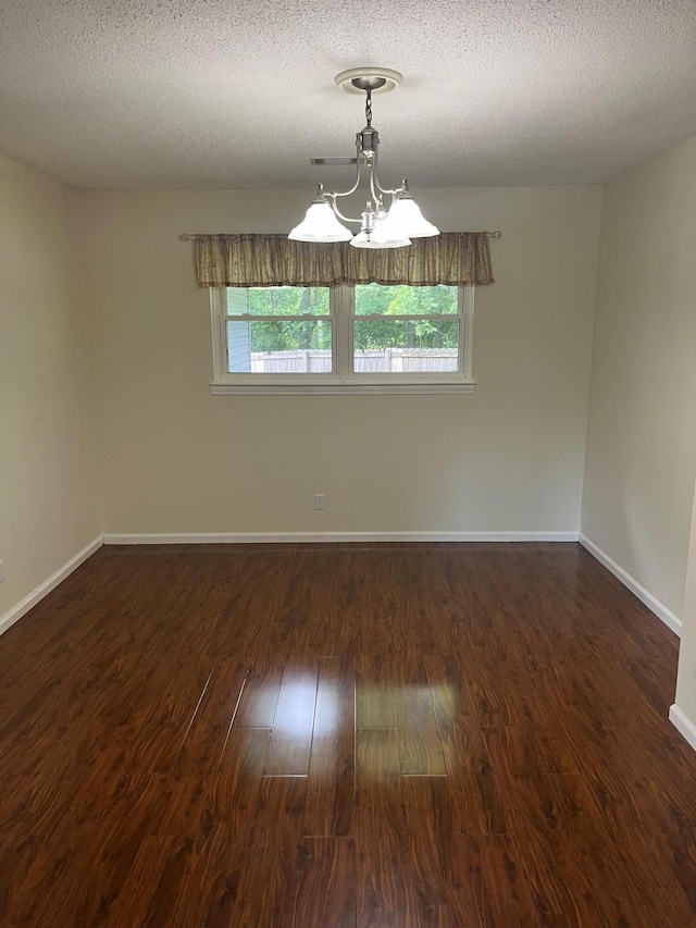 4510 Bluffwood Way, Cohutta, GA 30710 - spare room featuring wood finished floors, healthy amount of natural light, a chandelier, baseboards, and a textured ceiling