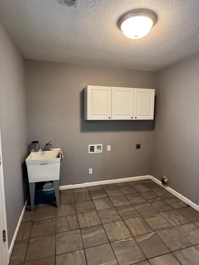 4510 Bluffwood Way, Cohutta, GA 30710 - laundry room featuring cabinet space, dark tile patterned flooring, a textured ceiling, hookup for a washing machine, and hookup for an electric dryer