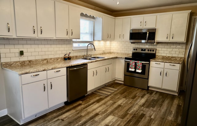 503 Kirby Dr, Cleveland, TN 37323 - kitchen with stainless steel appliances, white cabinets, and crown molding