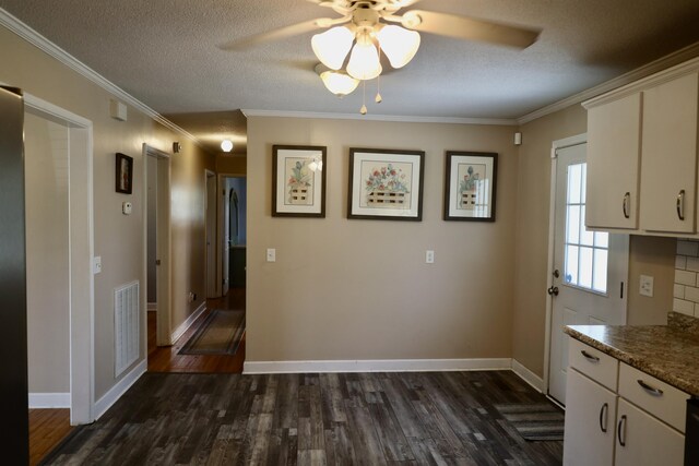 503 Kirby Dr, Cleveland, TN 37323 - kitchen with ceiling fan, dark wood-style flooring, ornamental molding, a textured ceiling, and white cabinetry