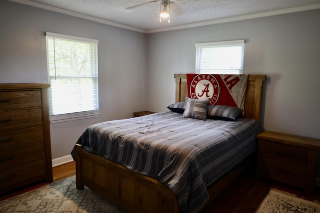 503 Kirby Dr, Cleveland, TN 37323 - bedroom featuring multiple windows, wood finished floors, a textured ceiling, ornamental molding, and a ceiling fan