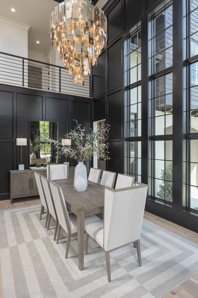 3634 Falkirk Way, Ooltewah, TN 37363 - dining room with a towering ceiling, a decorative wall, a chandelier, ornamental molding, and recessed lighting