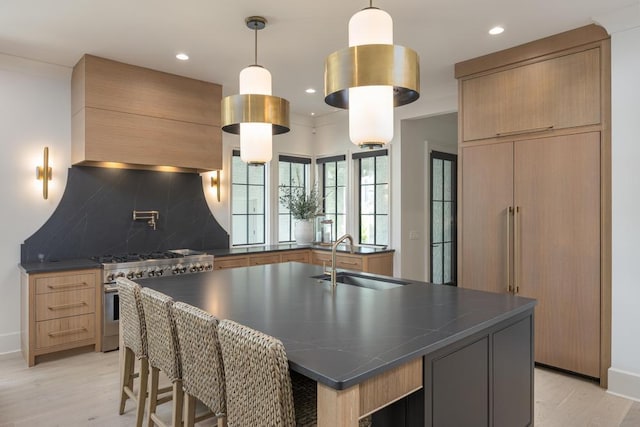 3634 Falkirk Way, Ooltewah, TN 37363 - kitchen featuring high end stainless steel range, dark countertops, light wood finished floors, backsplash, and recessed lighting
