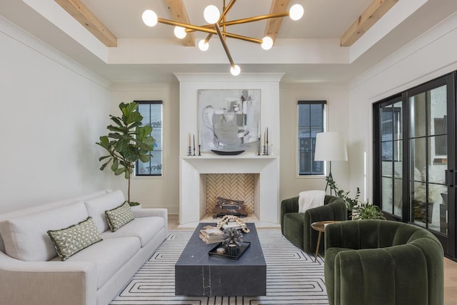 3634 Falkirk Way, Ooltewah, TN 37363 - living room featuring a tray ceiling, healthy amount of natural light, and a chandelier