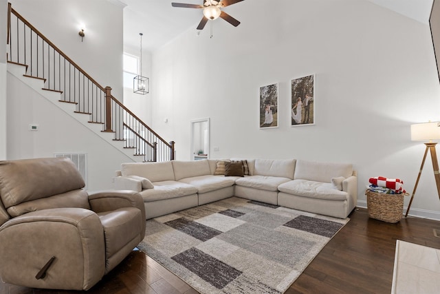 6434 Satjanon Dr, Ooltewah, TN 37363 - living room featuring ceiling fan, dark wood finished floors, a towering ceiling, and stairs