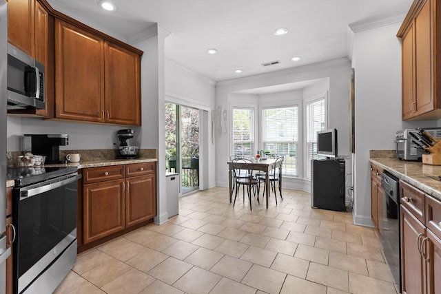 1008 Renaissance Ct, Chattanooga, TN 37419 - kitchen with appliances with stainless steel finishes, crown molding, recessed lighting, brown cabinetry, and light stone counters