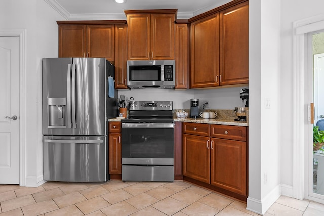 1008 Renaissance Ct, Chattanooga, TN 37419 - kitchen featuring appliances with stainless steel finishes, light stone countertops, light tile patterned flooring, brown cabinetry, and crown molding