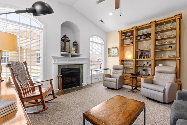 1008 Renaissance Ct, Chattanooga, TN 37419 - carpeted living room with ceiling fan, a tiled fireplace, and high vaulted ceiling
