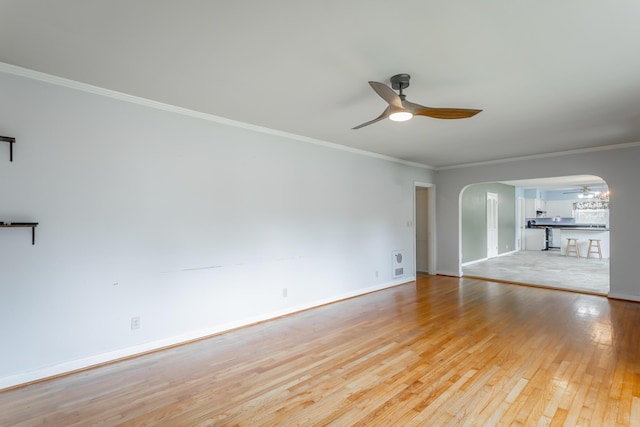 105 Joyce Ave, Red Bank, TN 37415 - empty room with ceiling fan, arched walkways, light wood finished floors, and ornamental molding