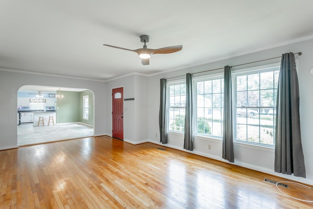 105 Joyce Ave, Red Bank, TN 37415 - spare room featuring arched walkways, ceiling fan, light wood-style floors, and crown molding