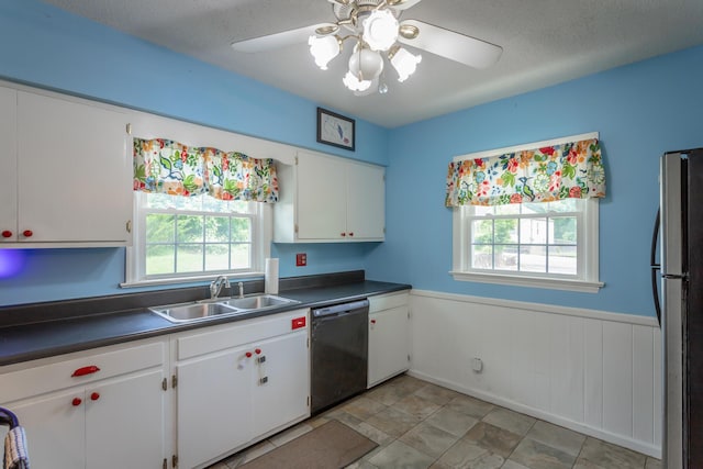 105 Joyce Ave, Red Bank, TN 37415 - kitchen with dishwasher, freestanding refrigerator, white cabinets, ceiling fan, and dark countertops