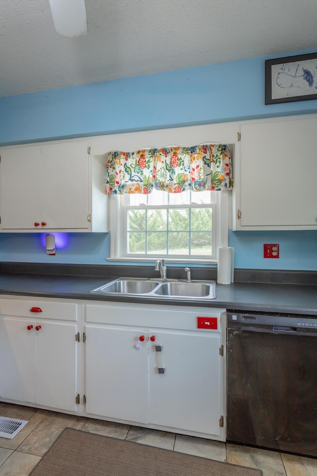 105 Joyce Ave, Red Bank, TN 37415 - kitchen featuring black dishwasher, white cabinets, dark countertops, and a textured ceiling