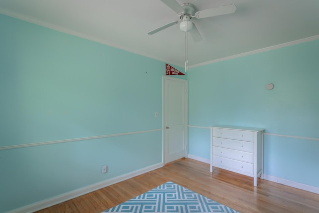 105 Joyce Ave, Red Bank, TN 37415 - unfurnished bedroom with wood finished floors, ornamental molding, and a ceiling fan